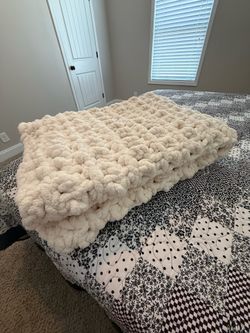 Large yarn crocheted blanket