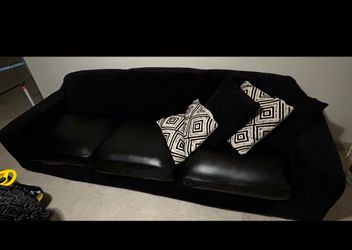Black Sofa and feet rest