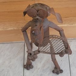Metal dog sculpture.