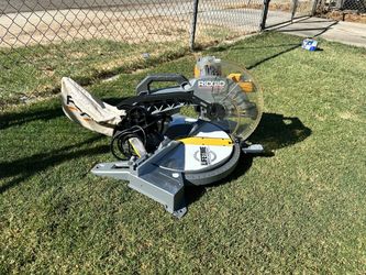 RIDGID Blade not included: 10-inch, 15-amp corded dual-bevel miter saw with LED cut-line indicator.