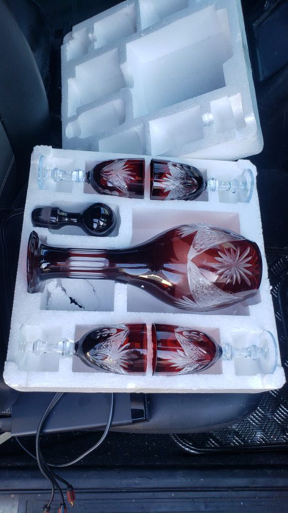 Ruby red crystal decanter set never used