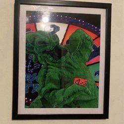Custom art piece of oogie boogie from nightmare before Christmas in black frame