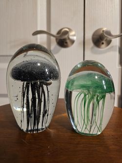 Two Glow-in-the-dark glass jellyfish