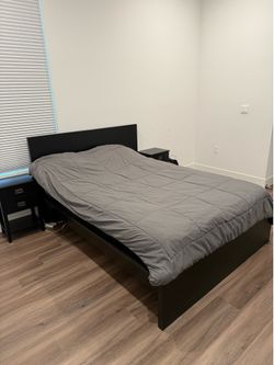 Black full size bed with 2 night stands