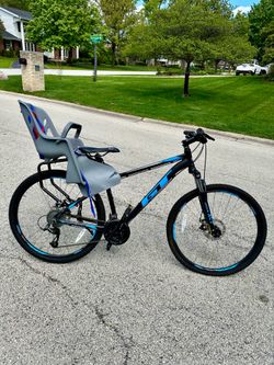 GT aggressor pro with baby carry on and helmet, like new only ridden a few times, 26”, frame size is medium