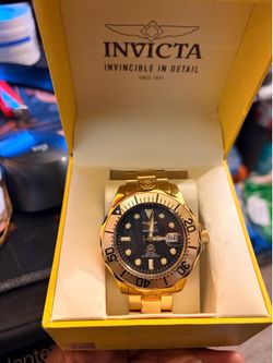 Gold Invicta men’s watch