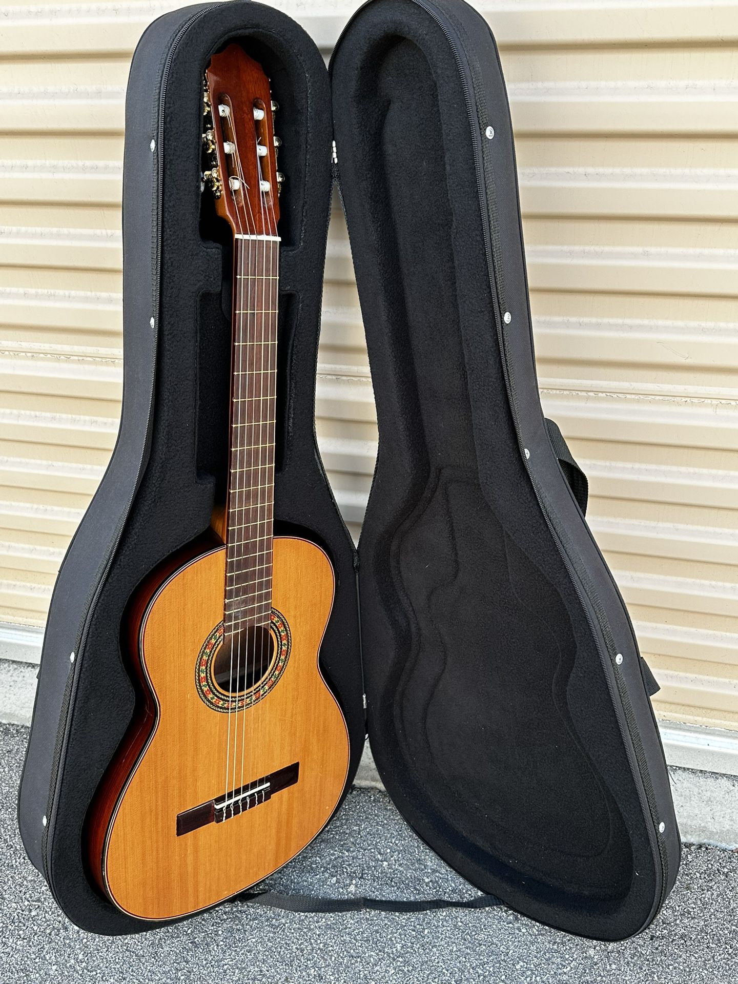 Paracho Acoustic Guitar with Hard Case.   Appraised at Guitar Center $210 w/out Hard Case ($100). Total Savings $155.