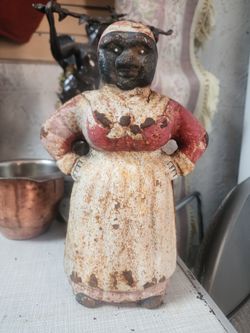 antique cast iron figure bank. size 10x5