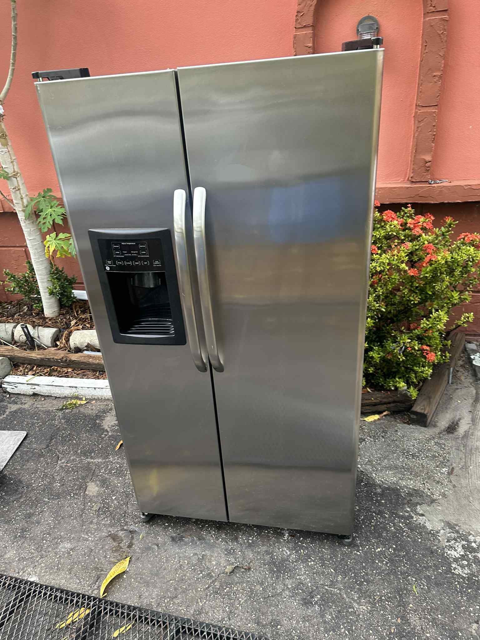 GE Stainless Steel Refrigerator; Side by Side