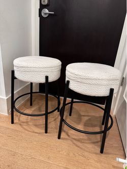 Pair of white boucle counter stools