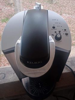 KEURIG coffee maker to make your coffee in one minute yields 4 cups