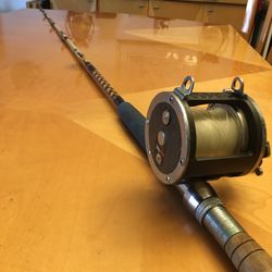 Daiwa Sealine Big Game 400H conventional saltwater fishing reel & 6’ 5” Hurricane fishing rod, specifically the 11-7 6/0 DX model, made by Spinmaster 