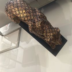 METAL TIGER MOUNTED SCULPTURE ON BLACK STAND