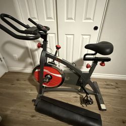 LIKE NEW - Sunny Health & Fitness Bike + Floor Mat (Used Once!)