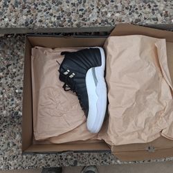 This is a pair of Air Jordan 12 Retro "Playoffs" sneakers. 