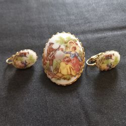 Renaissance Musical Scene Porcelain Brooch With Matching Earrings 1950s Era Cute. No cracks. Ornate trim. Clip on earrings with working clasps. Matchi