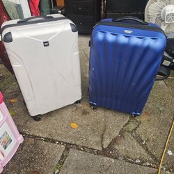 The Price Is Firm.. Two Hardcover Swivel Travel Luggage