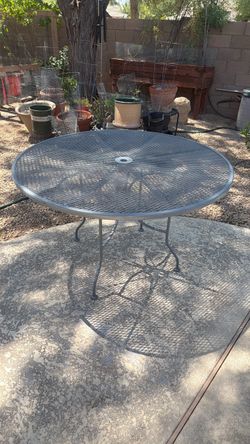 Wrought iron table and 4 chairs
