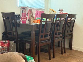 Wood table rectangular with 4 chairs plus a bench