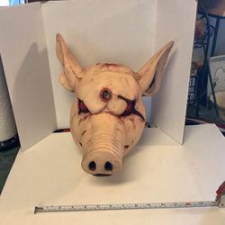 Butchered Pigs head prop solid hard rubber perfect for plays or Halloween approximately 12” tall 13” deep and about 12” wide Realistic features no iss