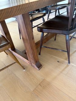 Beautiful  stain trestle dining table. Never used and perfect condition.. purchased new in 2024.