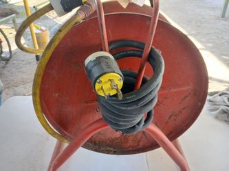 2 WATERPROOF EXTENSION CORDS ON REELS 50 FT  $60  FOR BOTH.