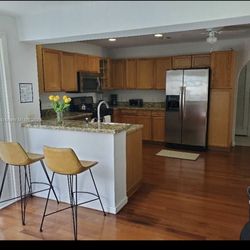 Two counter chairs upholster in leather