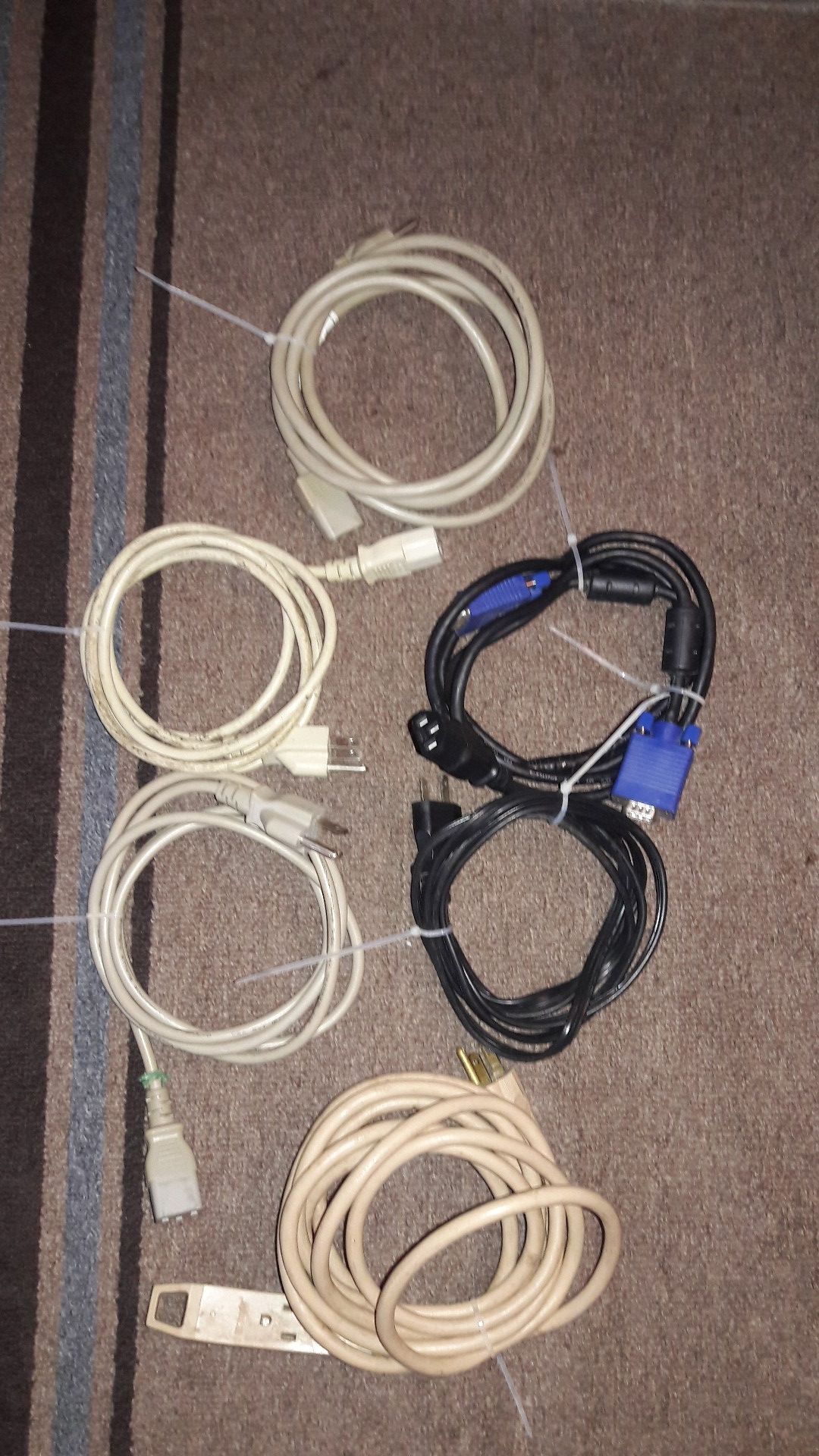 Assorted computer power cords and monitor cords