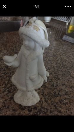 statuette girl with a bird