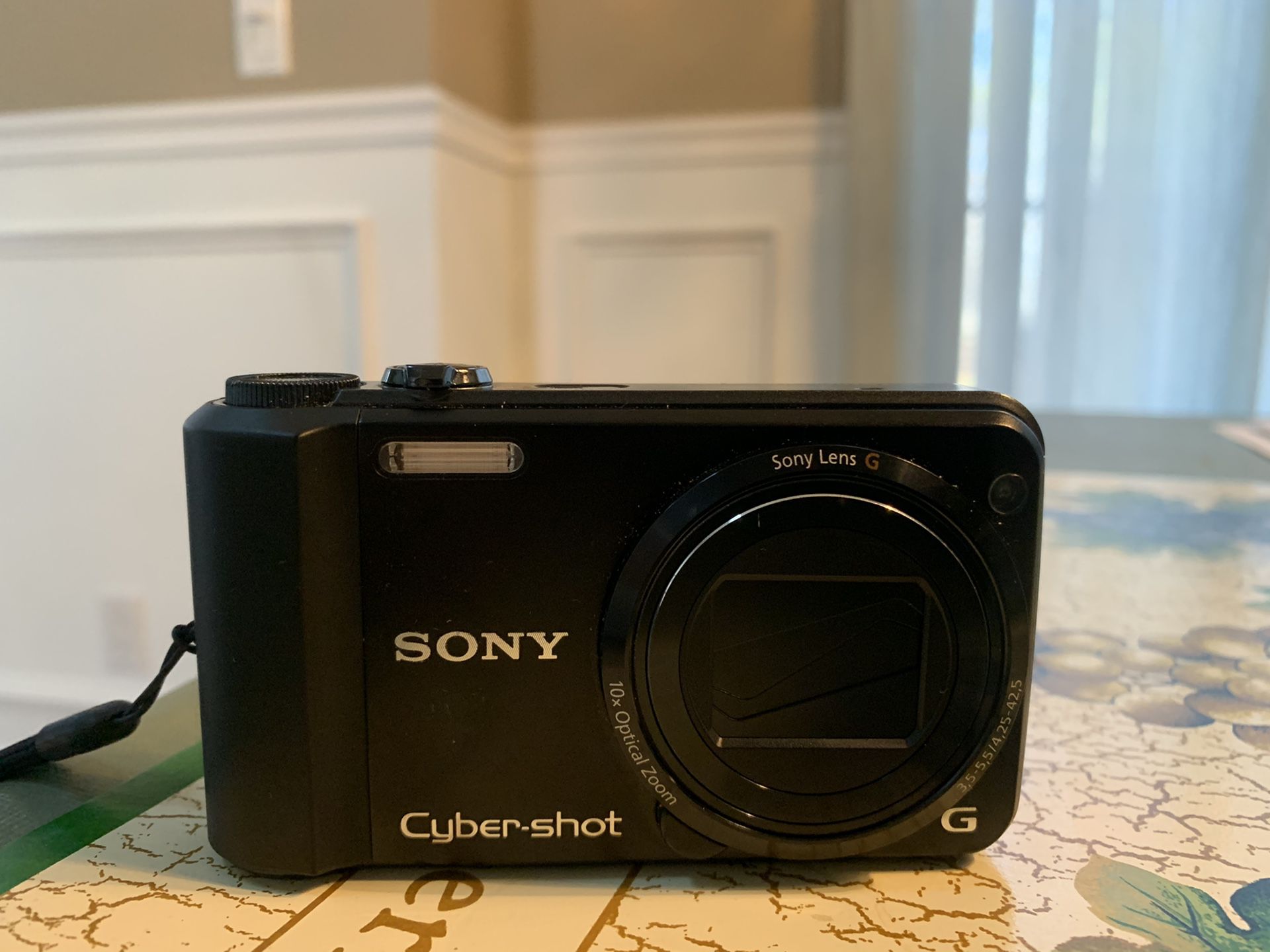 Sony Cybershot DSC-H70 16.1 MP Digital still camera with 10x wide angle zoom G lens and 3.0 inch lcd black. Comes with carry case and sd card