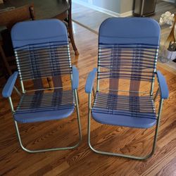 Two Vinyl Folding Lawn Chairs