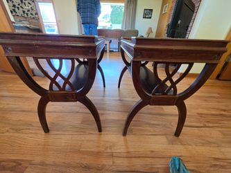 Pair of Antique Mahogany end tables with a lip around the edge. Note the beautiful ornate woodwork
26" d x 14"w x 24"h