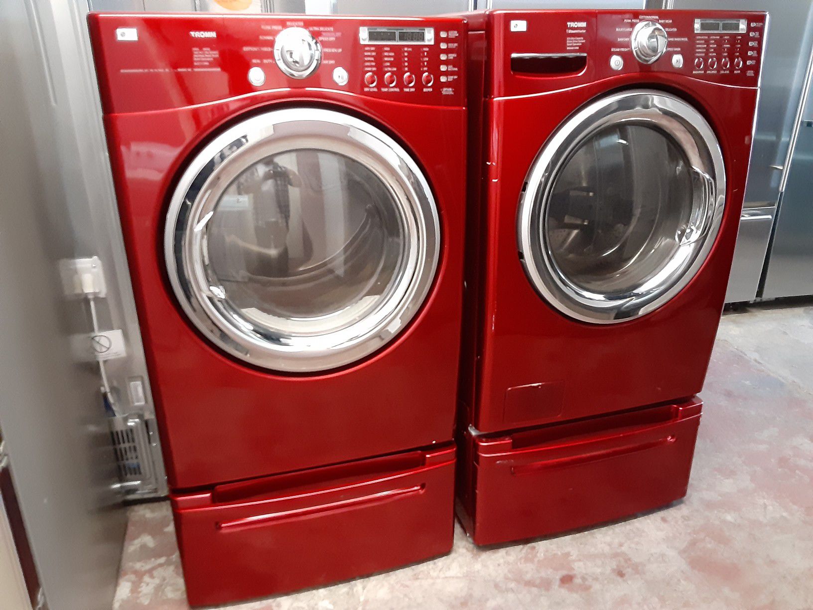 Lg red washer and dryer front load set with pedestals gas