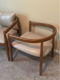 Set of two modern arm chairs . Wood and leather