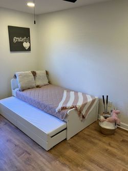 IKEA twin bed frame with trundle and storage