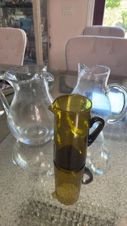 Three glass pitchers