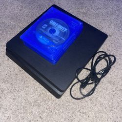 PS4 Slim w/ power cord + 3 games