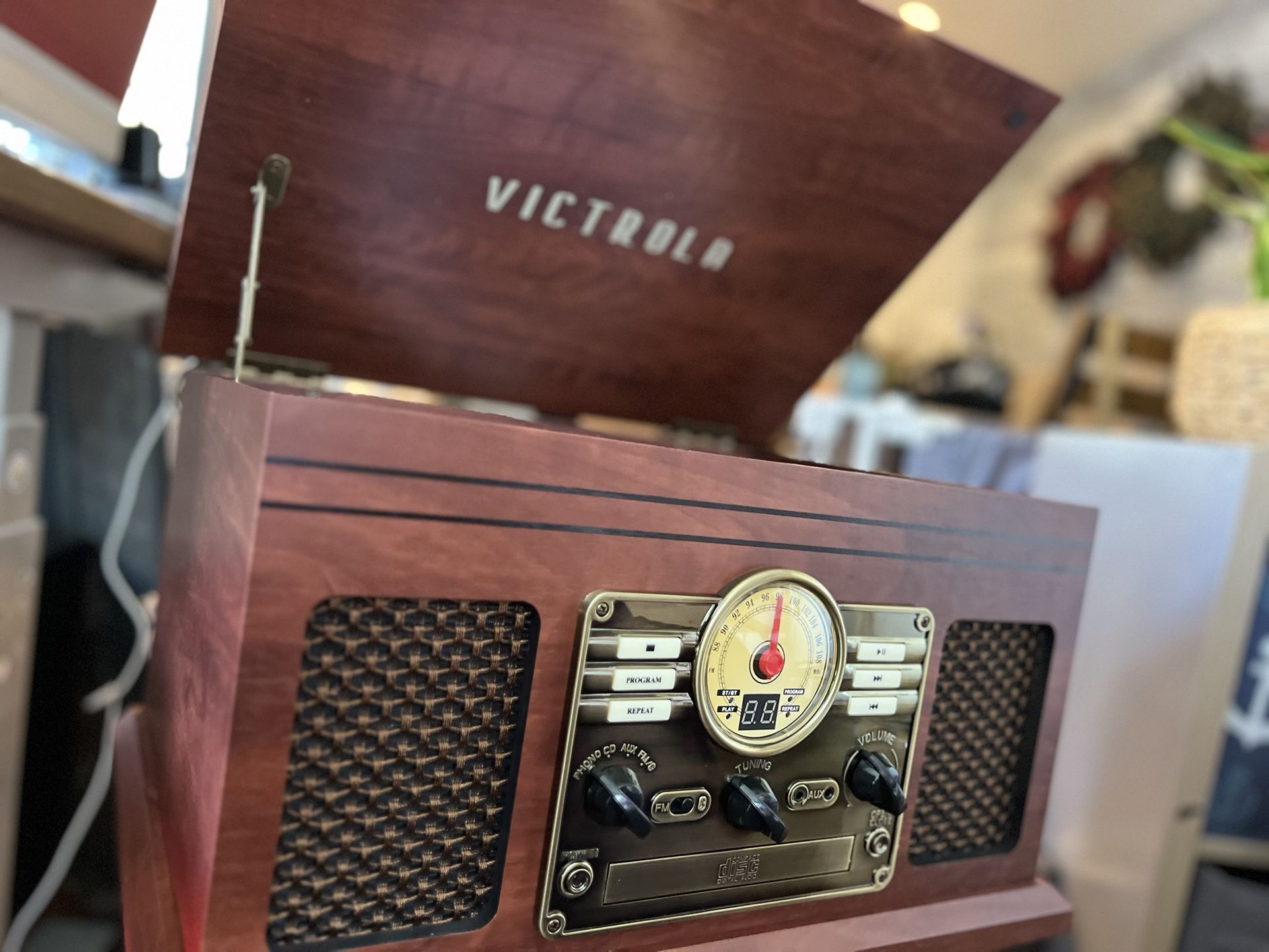 The Victrola 6-in-1 Nostalgic Record Player packs awesome features into a classic package