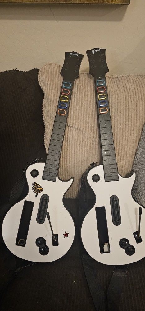 Two Nintendo Wii Guitar Hero Controllers