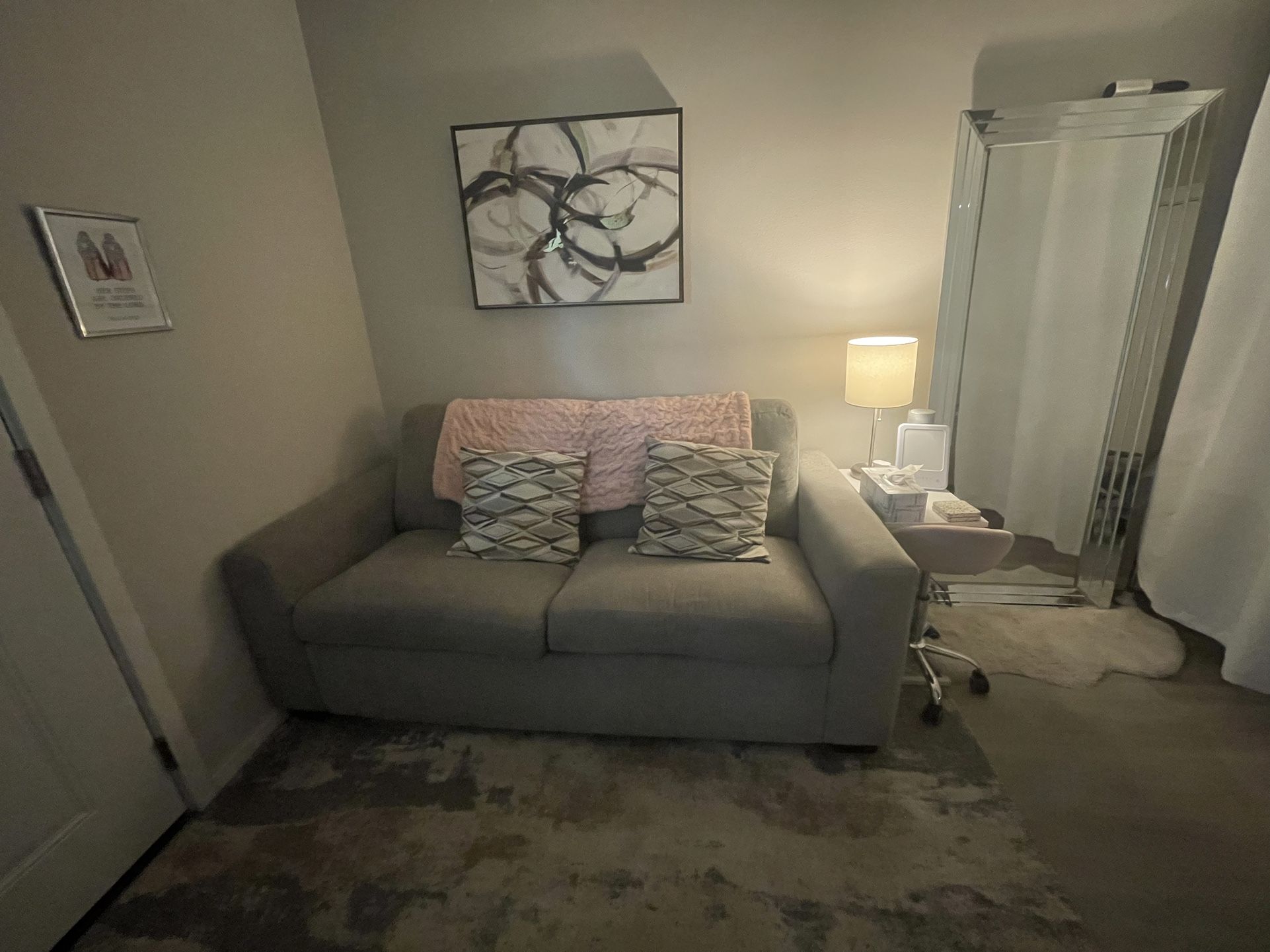 Grey Couch. Foldable Bed inside.