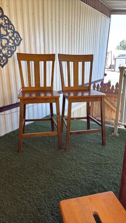 Two high wooden chairs