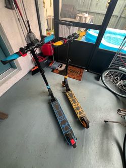 Two Kids Electric Scooters Blue and Orange