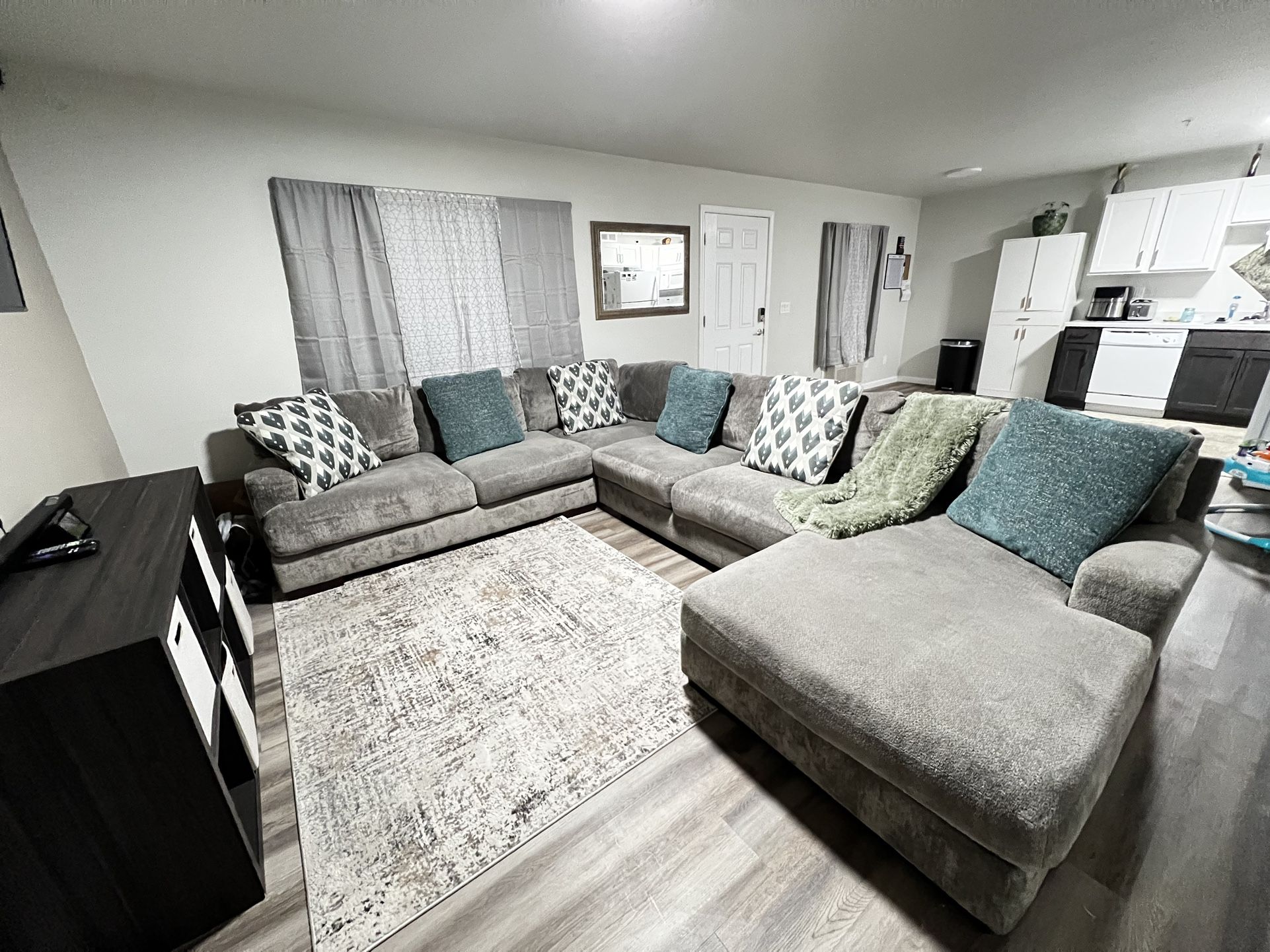 Ashley home furniture, very large sectional with chase and ottoman