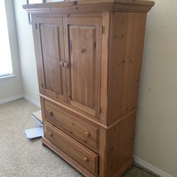 Light Brown Armoire Piece new . 150$ (Tv $ Dog Not Included)