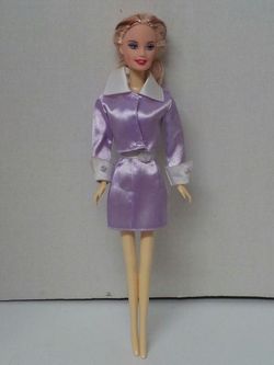 Pretty blonde doll dressed in purple