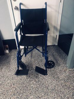 A transporter wheelchair