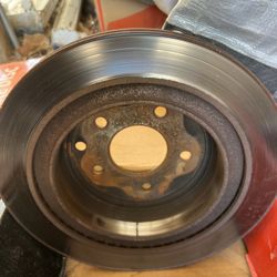 Used brake pads & rotors from a 2003 Nissan 350Z.