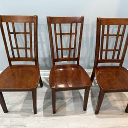 3 wooden chairs and 1 table 