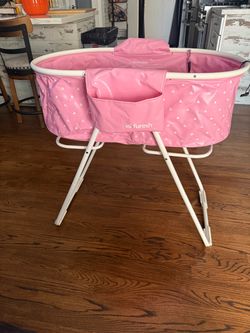 a Furesh Elevated Folding Pet Bath Tub & Wash Station in pink