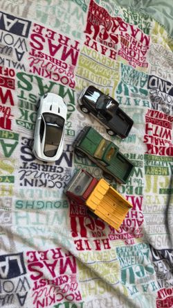 Lot of 4 1/24 trucks and cars - Dodge, Chevy, jaguar,